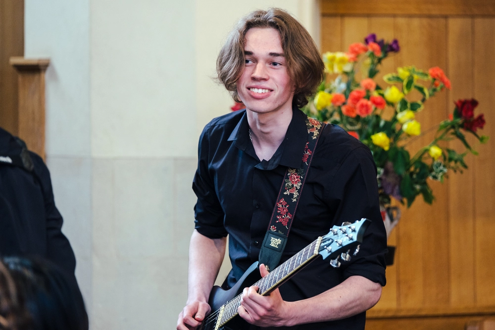 Student playing guitar