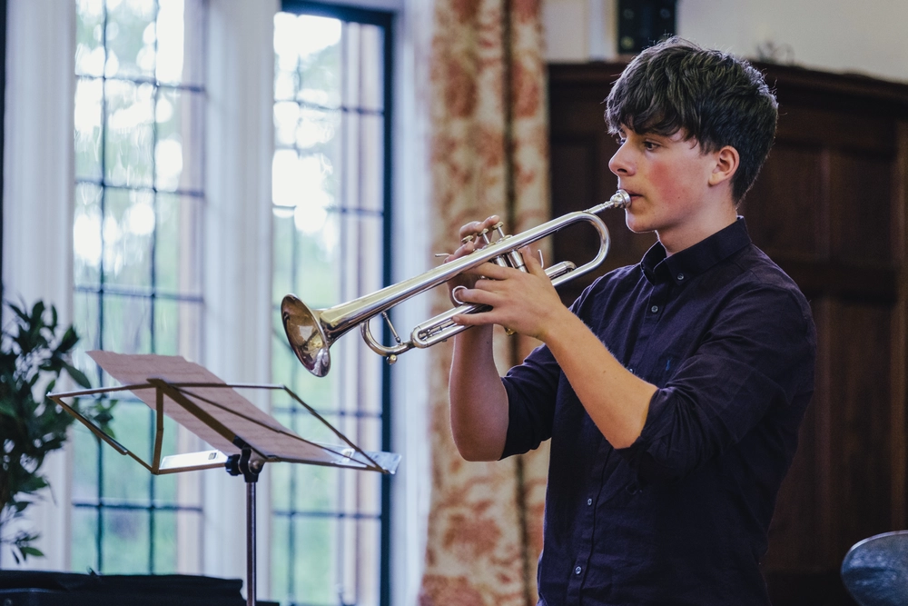 Student playing the trumpet during a Bristol Pre-Con